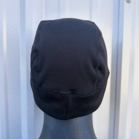 Black hooded garment on a mannequin against a white background