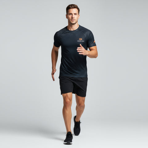 Man wearing a black athletic outfit with a logo on a gray background