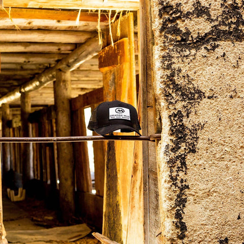 Orange Mud 5-Panel Black Trucker Hat flat lay product view