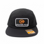 Black cap with Orange Mud logo on a white surface