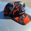 Orange_Mud_Splatter_Performance_Hat_Side_View Further Out