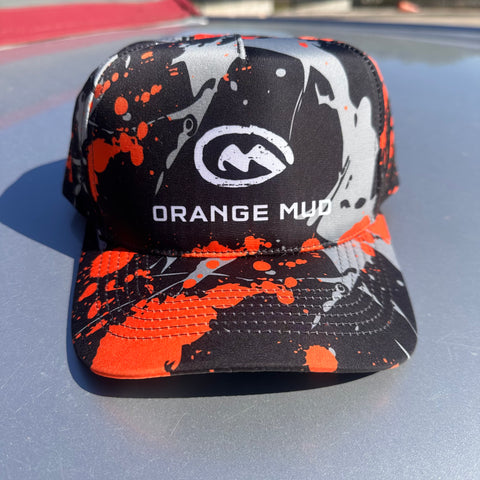 Orange_Mud_Splatter_Performance_Hat_on_a_car