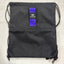 Orange Mud, LLC Packs Black with Purple Strap Sling Bag