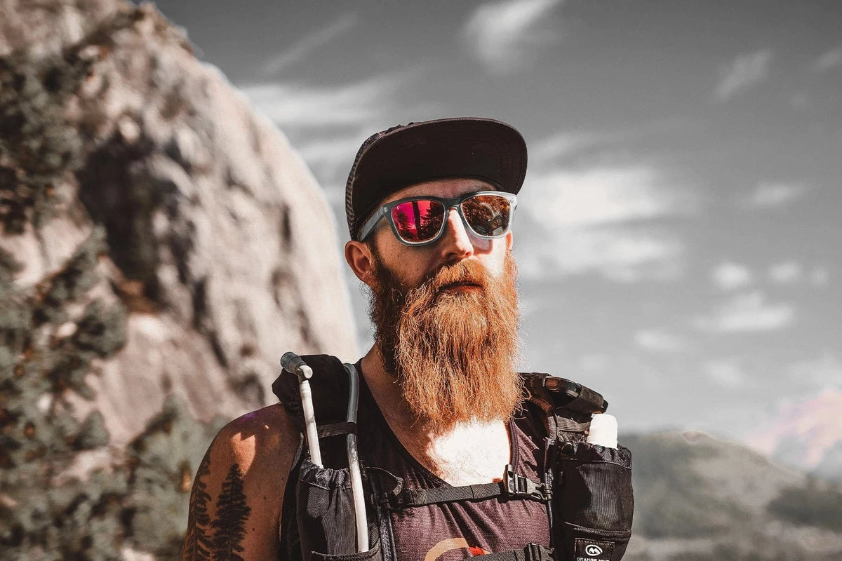 Bearded trail runner wearing an Orange Mud Endurance Pack